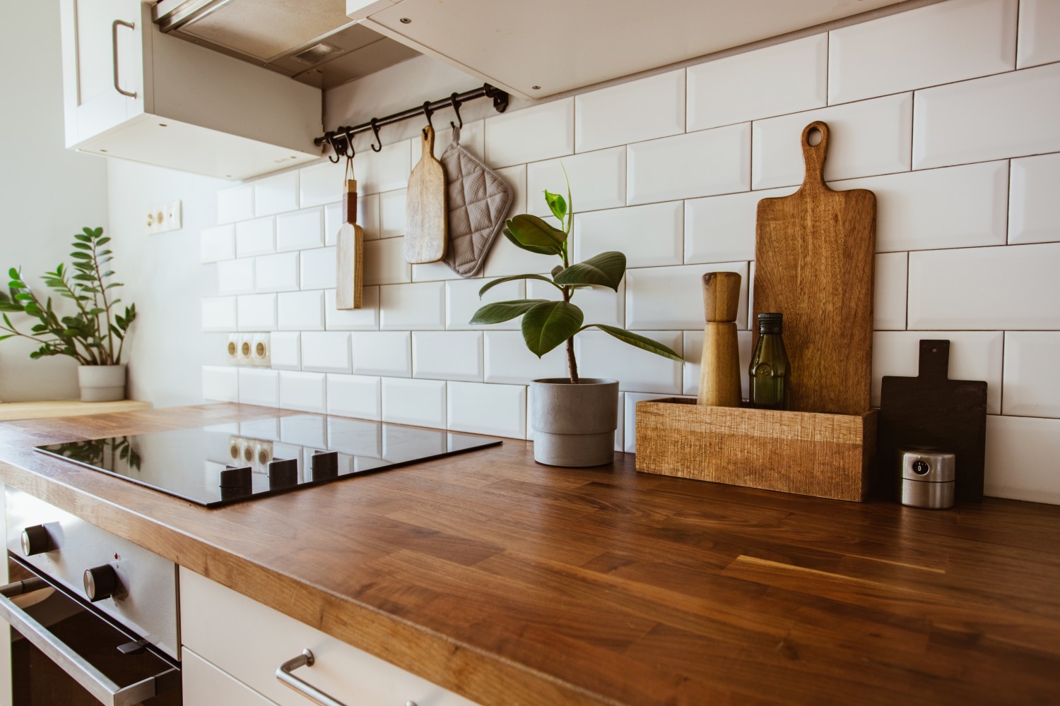 Kitchen brass utensils, chef accessories. Hanging kitchen with white backsplash tiles chicago
